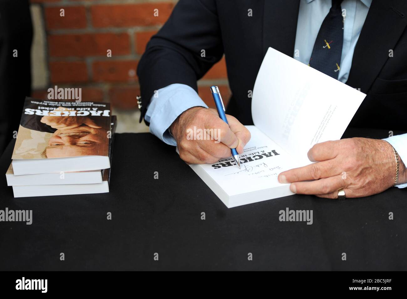 Robin Jackman signs a copy of his autobiography Stock Photo - Alamy