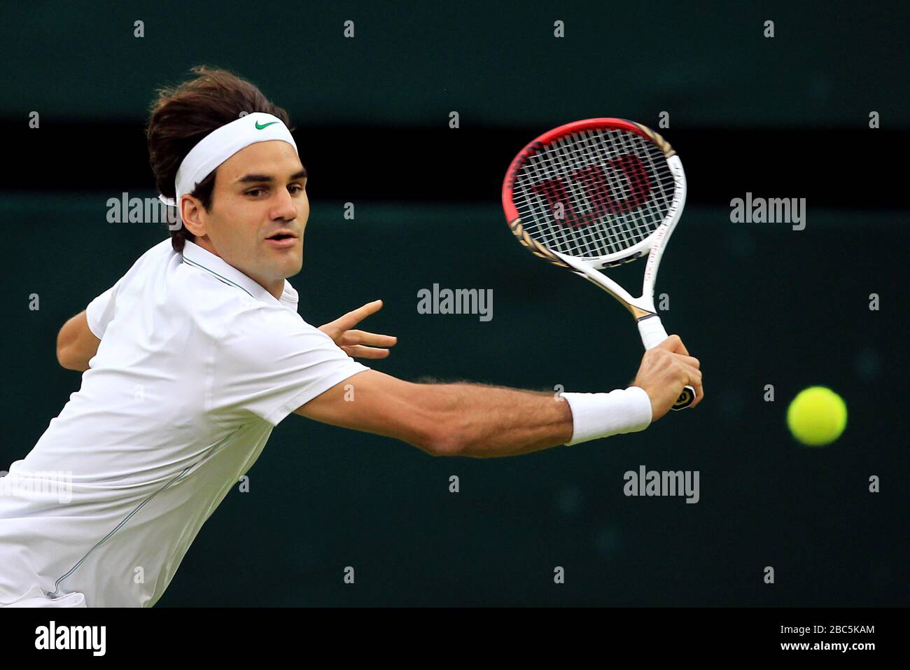 Switzerland's Roger Federer in action against Serbia's Novak Djokovic Stock Photo