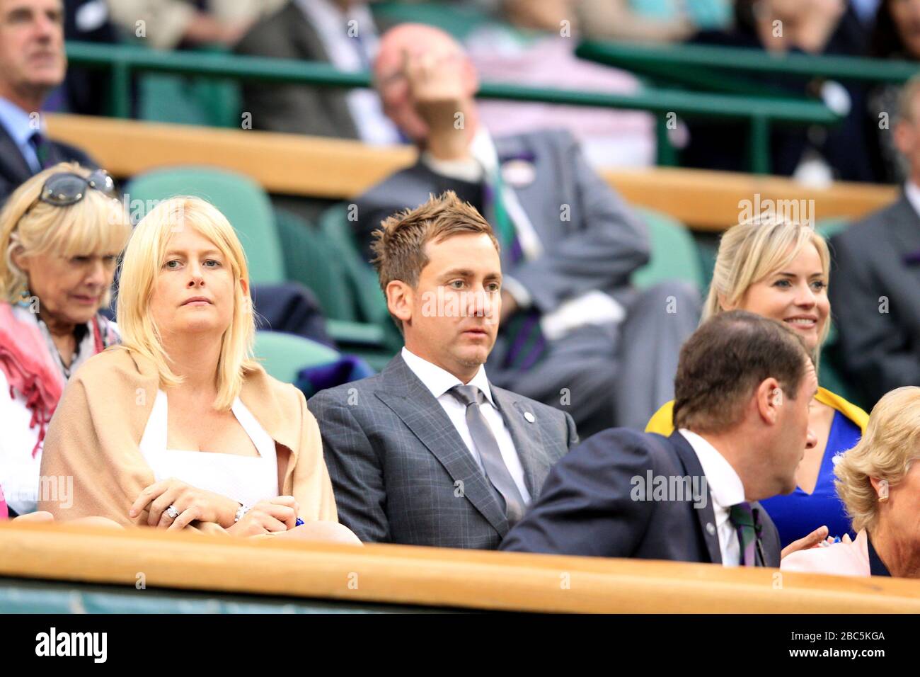 Golfer Ian Poulter (centre) and his wife Katie Poulter (left) in the