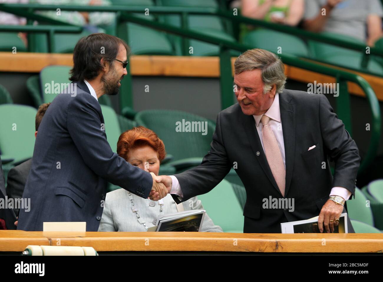 Author J.K Rowling's husband Neil Murray (l) shakes hands with Terry Wogan Stock Photo