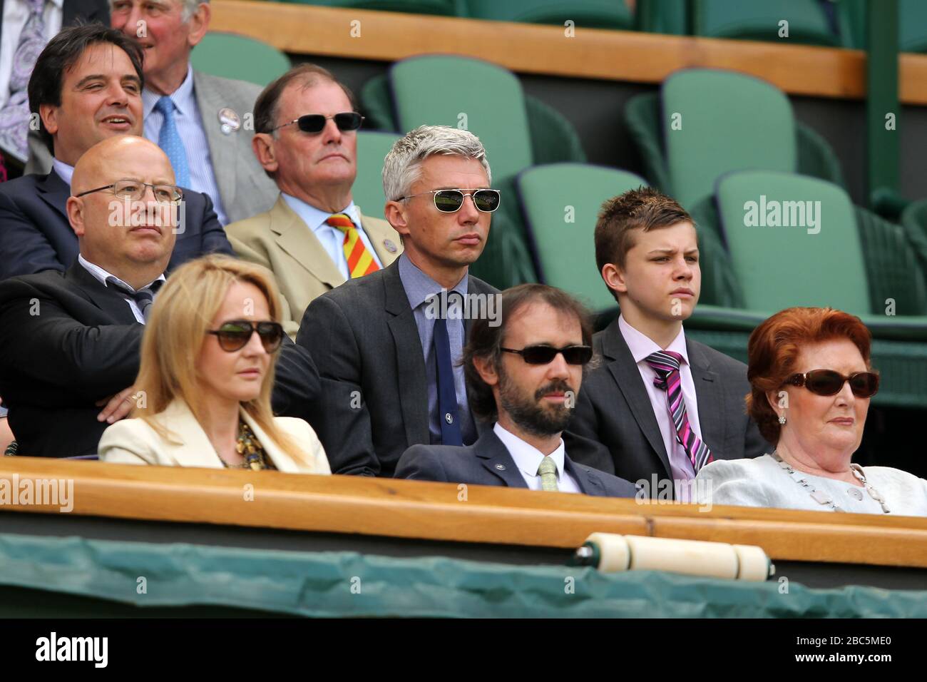 Author J.K Rowling (bottom left) with her husband Neil Murray (bottom centre) and Jonathan Edwards (middle row, centre) watch the action Stock Photo