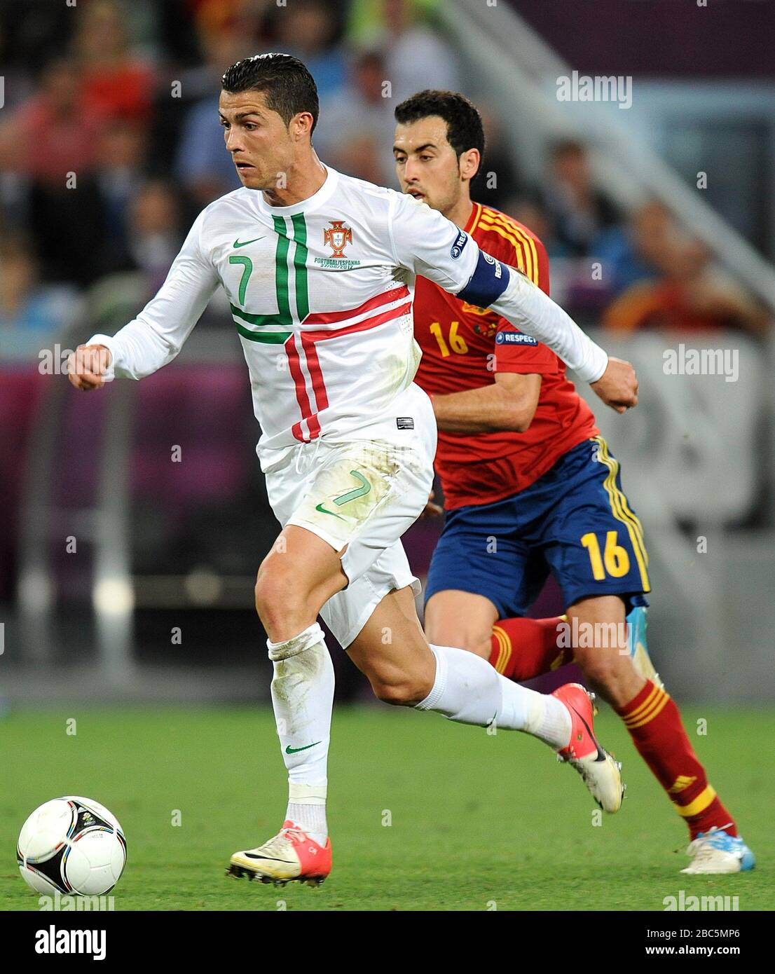 Portugal's Cristiano Ronaldo (left) and Spain's Sergio Busquets (right