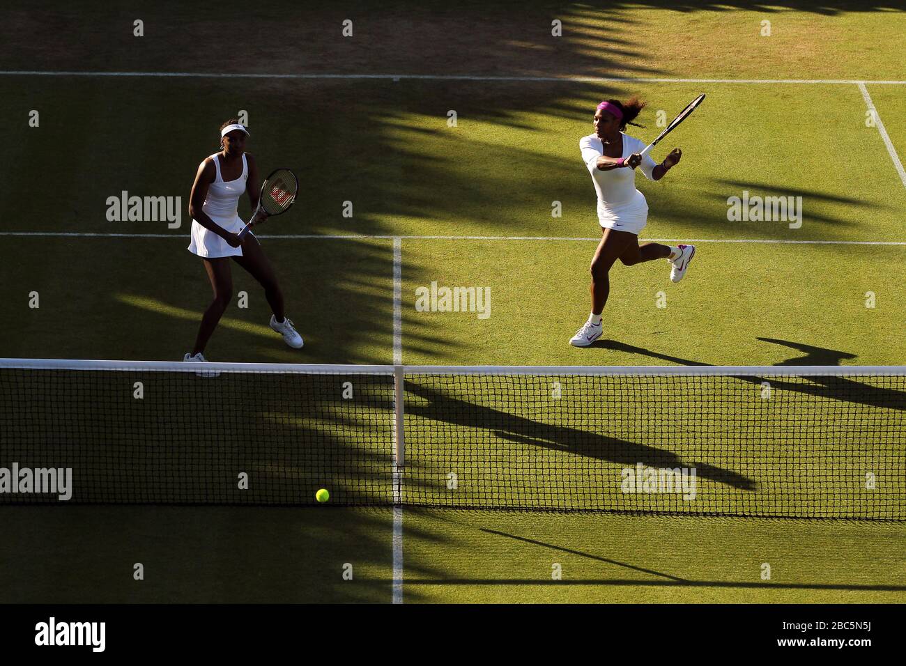 USA's Serena and Venus Williams (left) in action in their doubles game against Serbia's Vesna Dolonc and Ukraine's Olga Savchuk Stock Photo