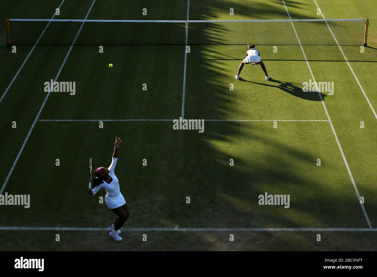 USA's Serena (l) and Venus Williams in action in their doubles game against Serbia's Vesna Dolonc and Ukraine's Olga Savchuk Stock Photo