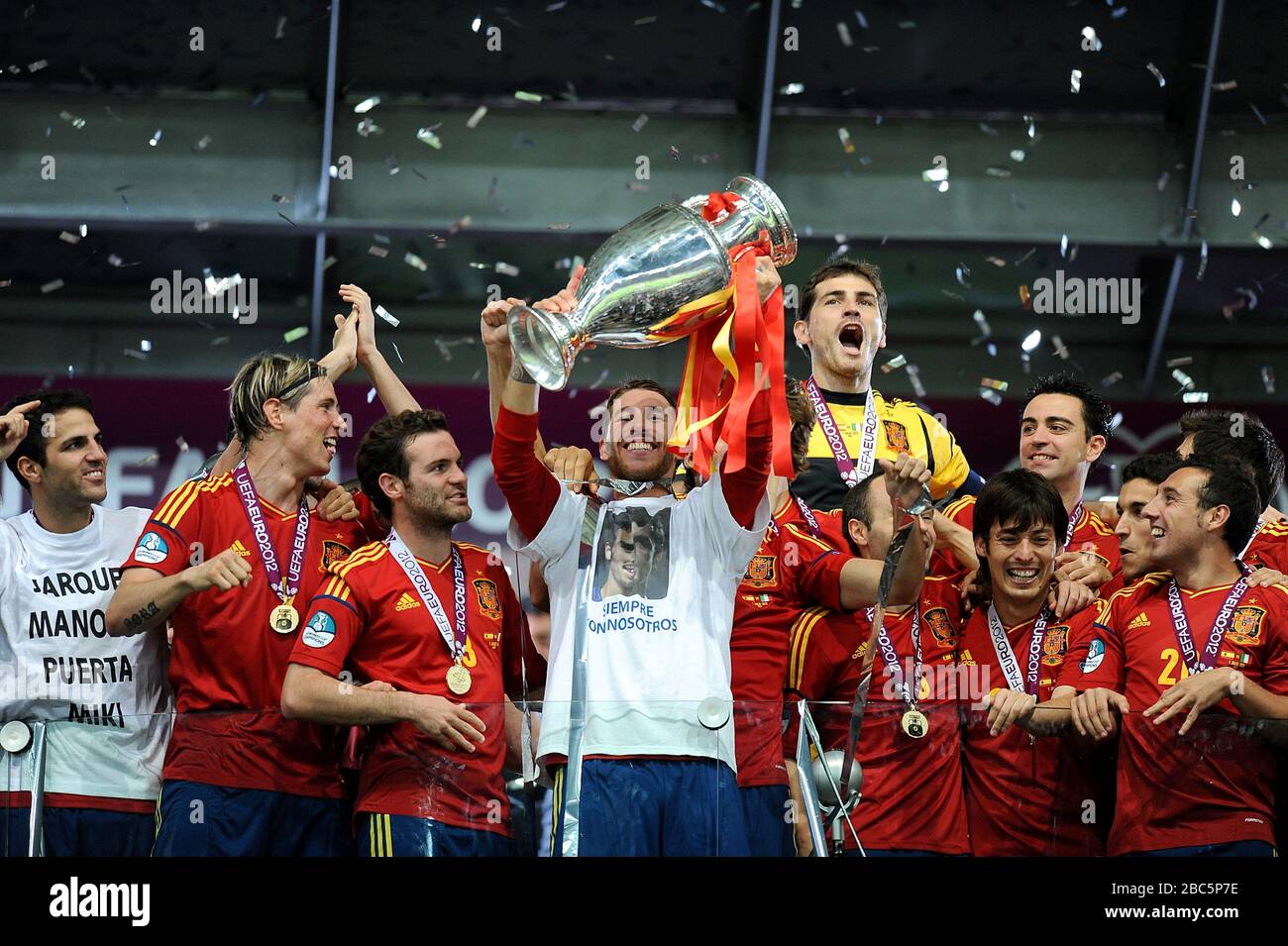 Spain's Sergio Ramos lifts the UEFA European Championship trophy after the final whistle Stock Photo