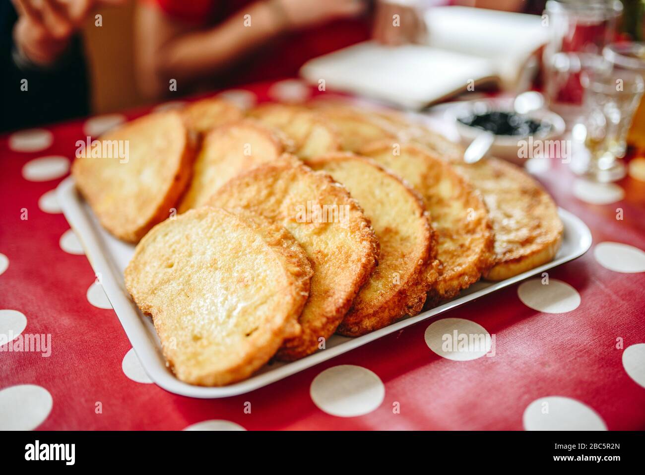 Fried bread breakfast with fruit jam. Balkan food. Bulgarian traditional cuisine. Stock Photo