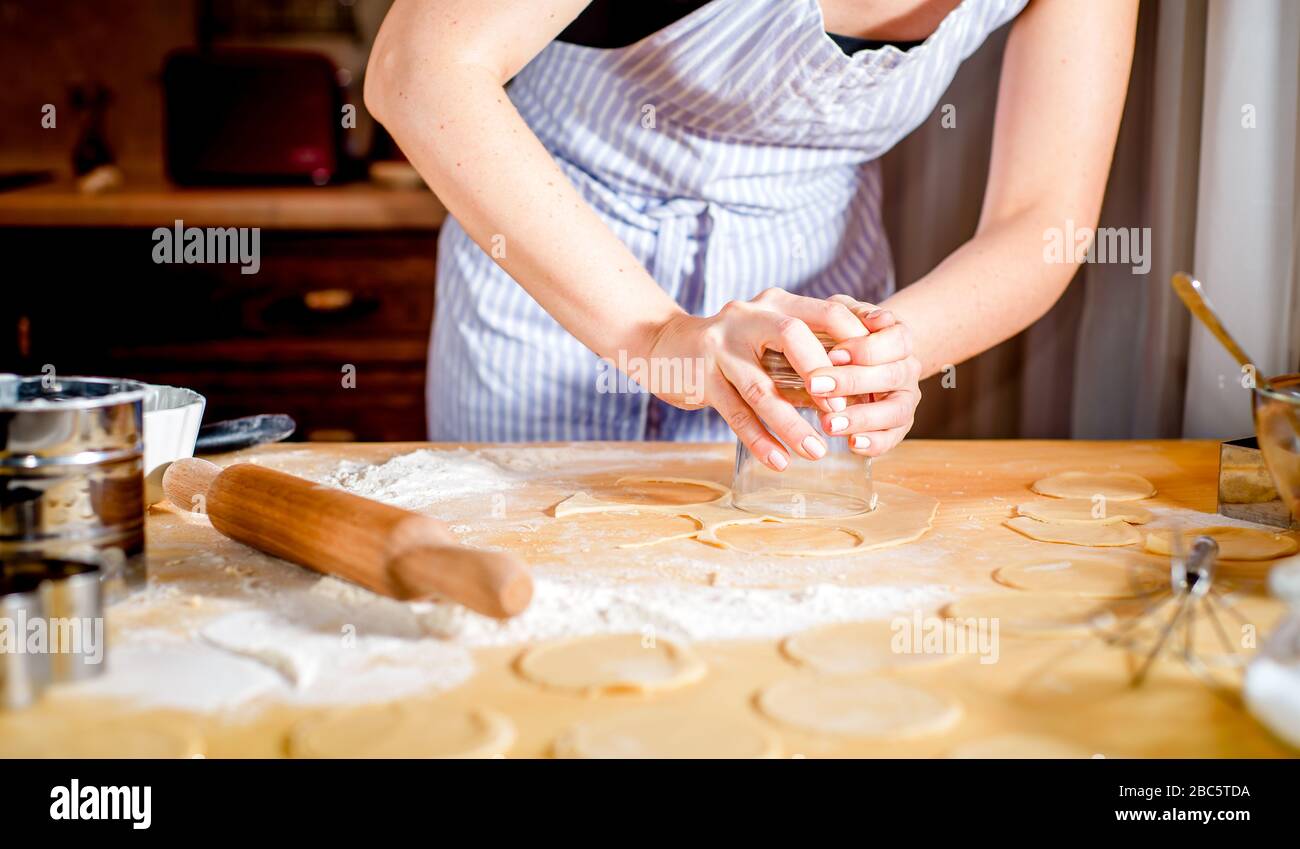 Making dough by female hands on kitchen table, close up Stock Photo - Alamy