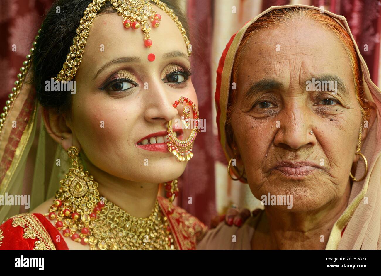 Grand mother blessing bride on wedding day Stock Photo
