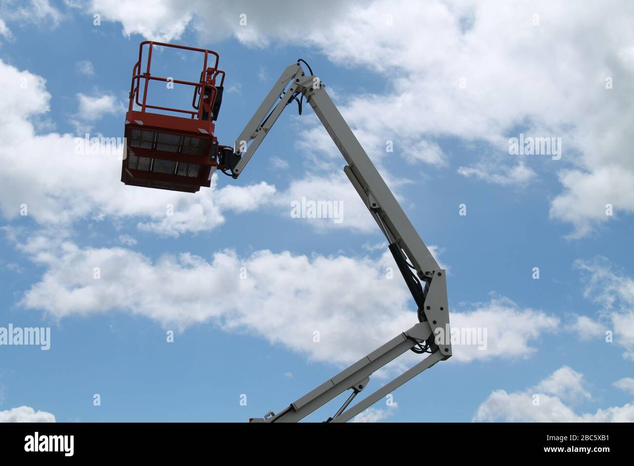 The Cage and Long Arm of a Cherry Picker Lift. Stock Photo