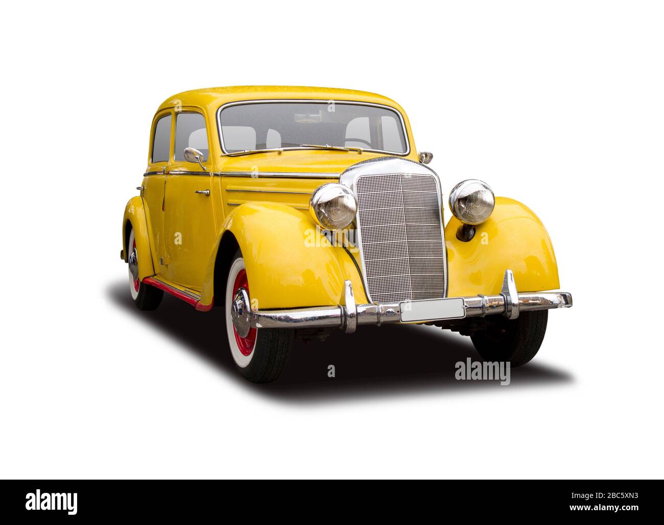 Yellow antique German car side view isolated on white Stock Photo