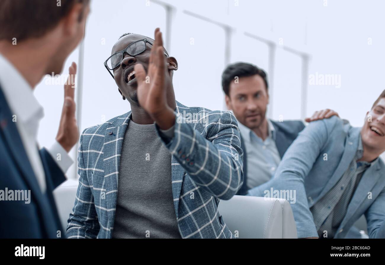 successful employees giving each other a high five Stock Photo - Alamy