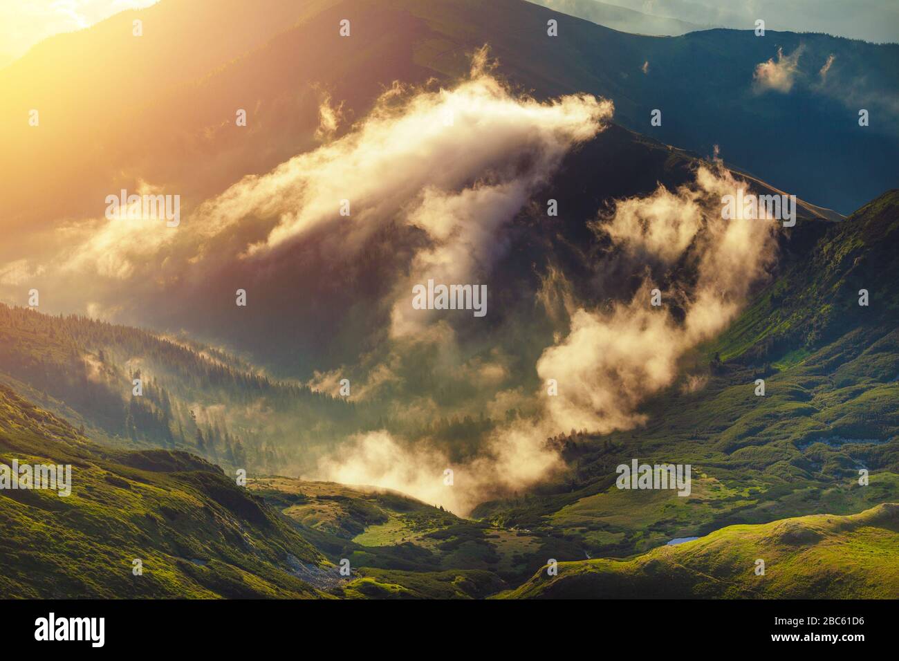 Mist rolling over peaks hi-res stock photography and images - Alamy