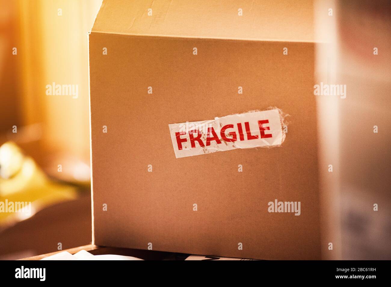 Fragile tape sticker on box Stock Photo
