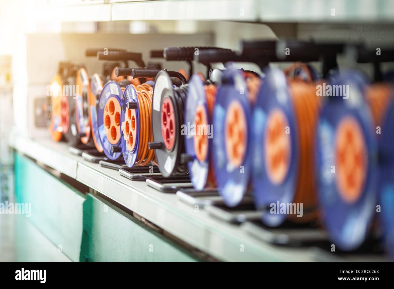 Long extension cords roll with european plug outlet Stock Photo Alamy