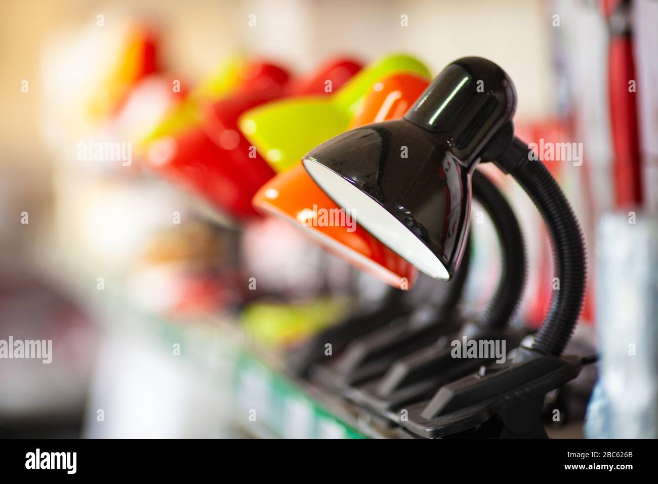 Small simple desk lamps on hardware store or electronics shop shelf Stock Photo