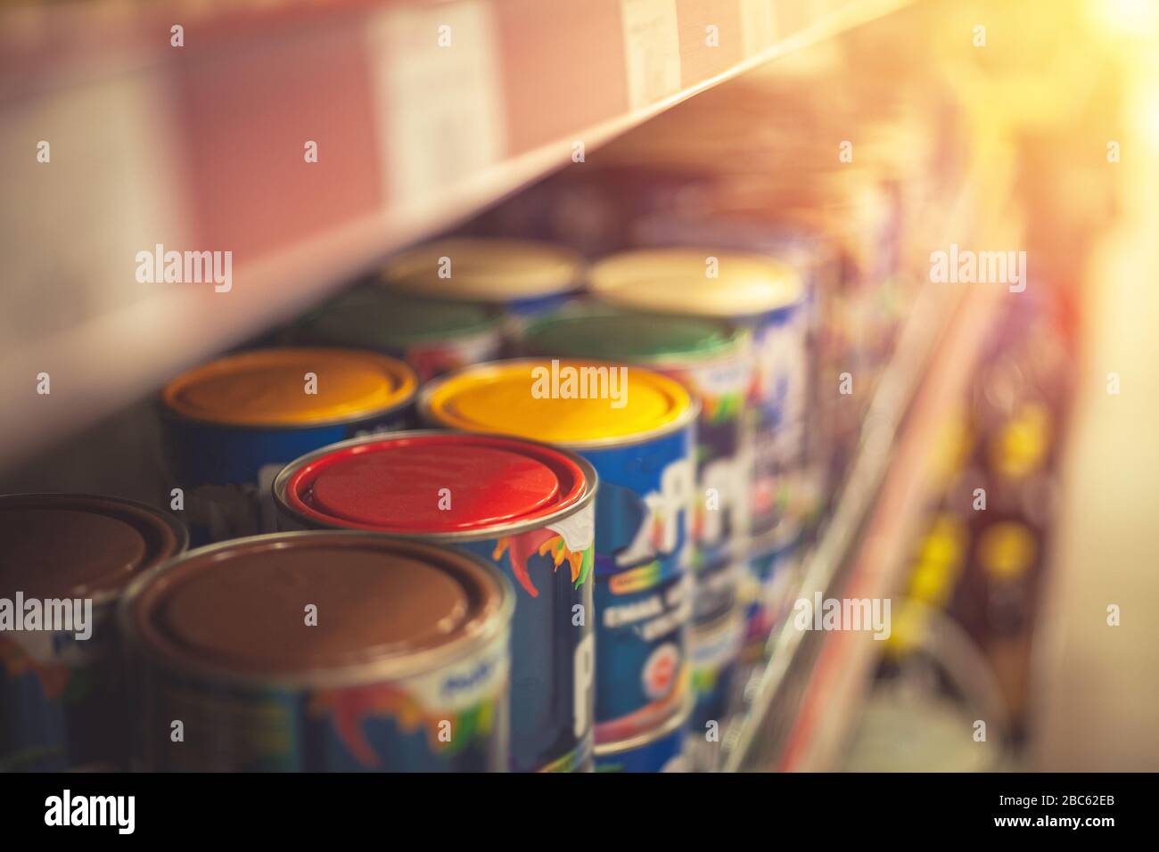 Canned paint, different colours on shelf Stock Photo Alamy