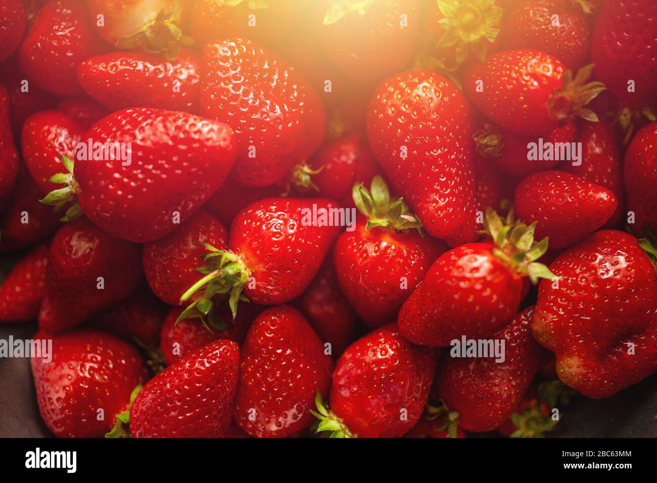 Vibrant strawberry background, fresh and healthy fruits Stock Photo - Alamy