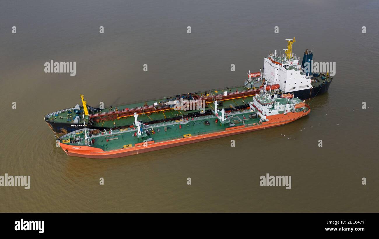 Ayon, Chukotski region, Russia - September 2, 2019: The top view on the Chukotka+ and Tiksi tankers on mooring. Shooting from above drone. Stock Photo