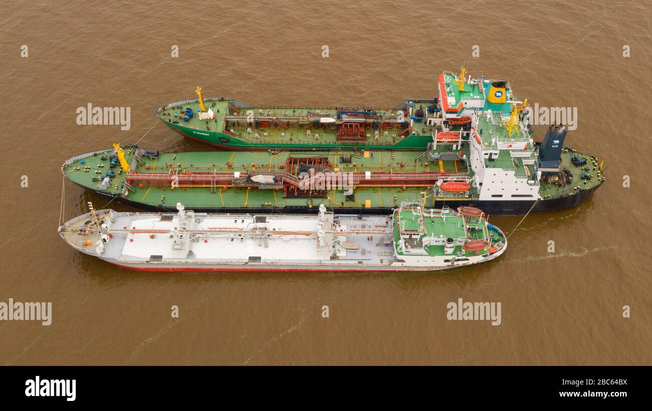 The tankers Chukotka+, Egvekinot, and Lenaneft 2033 are moored to each other, overload oil products. Stock Photo