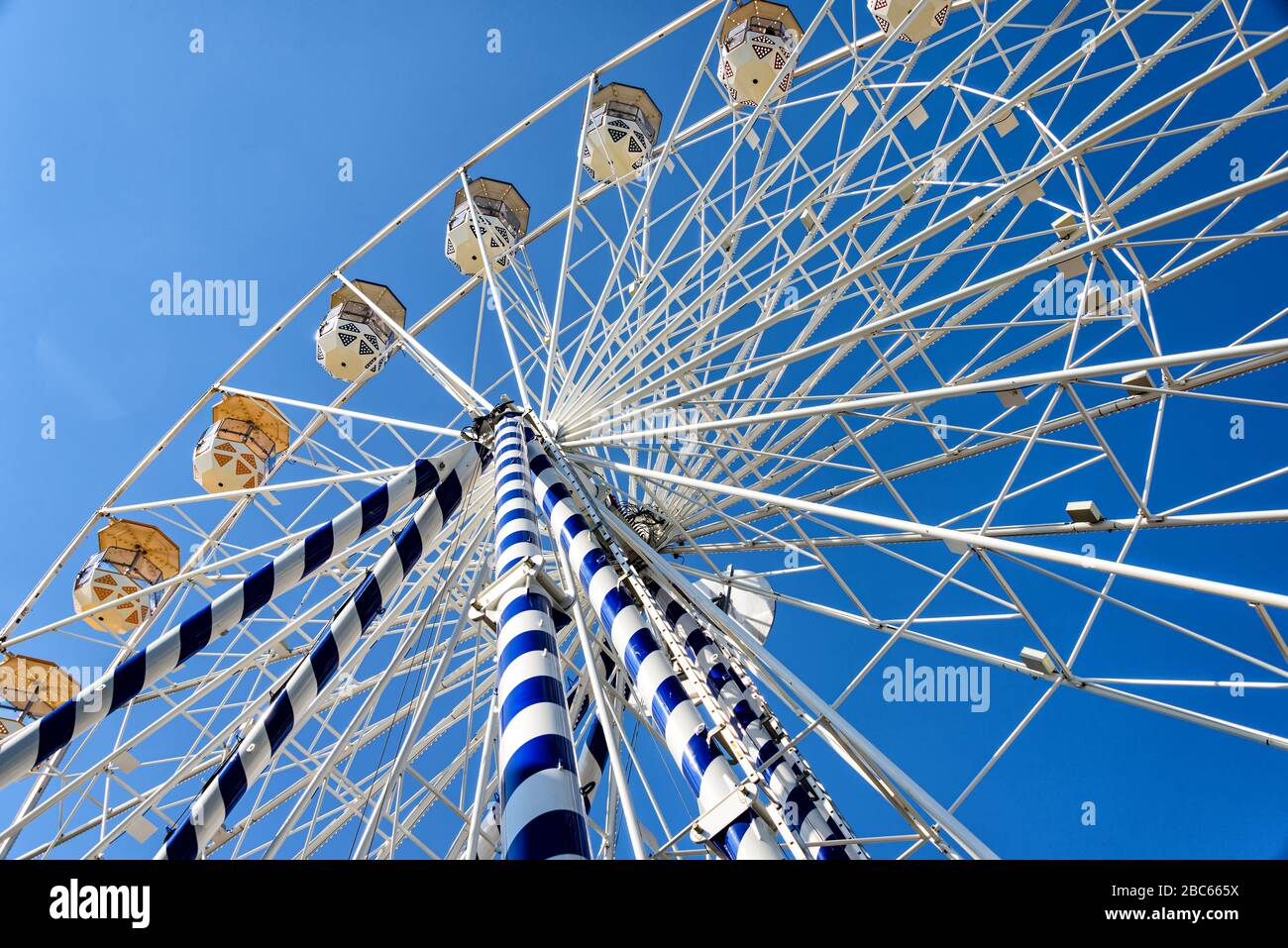 White ferris wheel against blue sky Stock Photo - Alamy