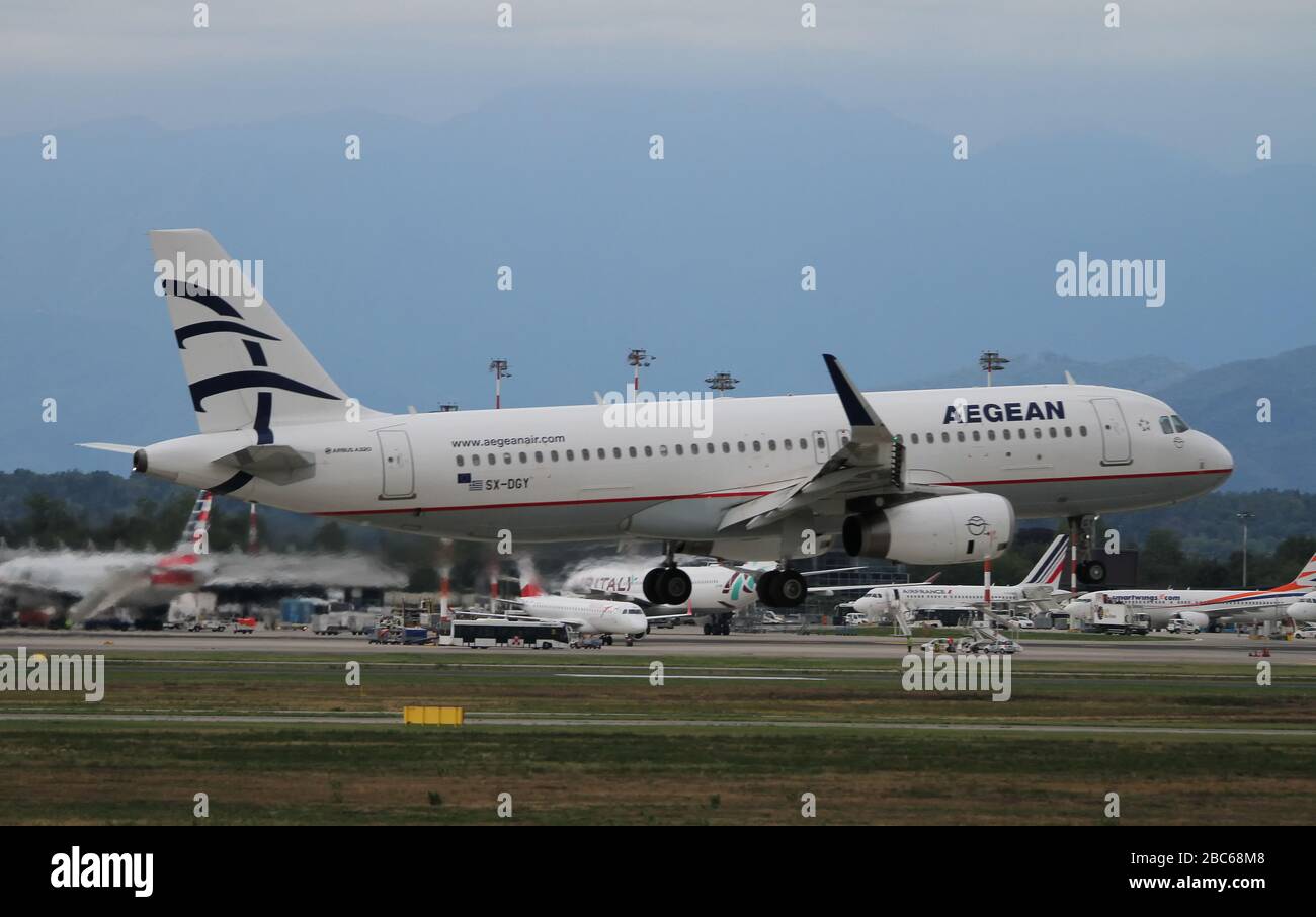 Aegean Airlines Airbus A320-232 SX-DGY comming into land at Malpensa (MXP / LIMC), Milan, Italy Stock Photo