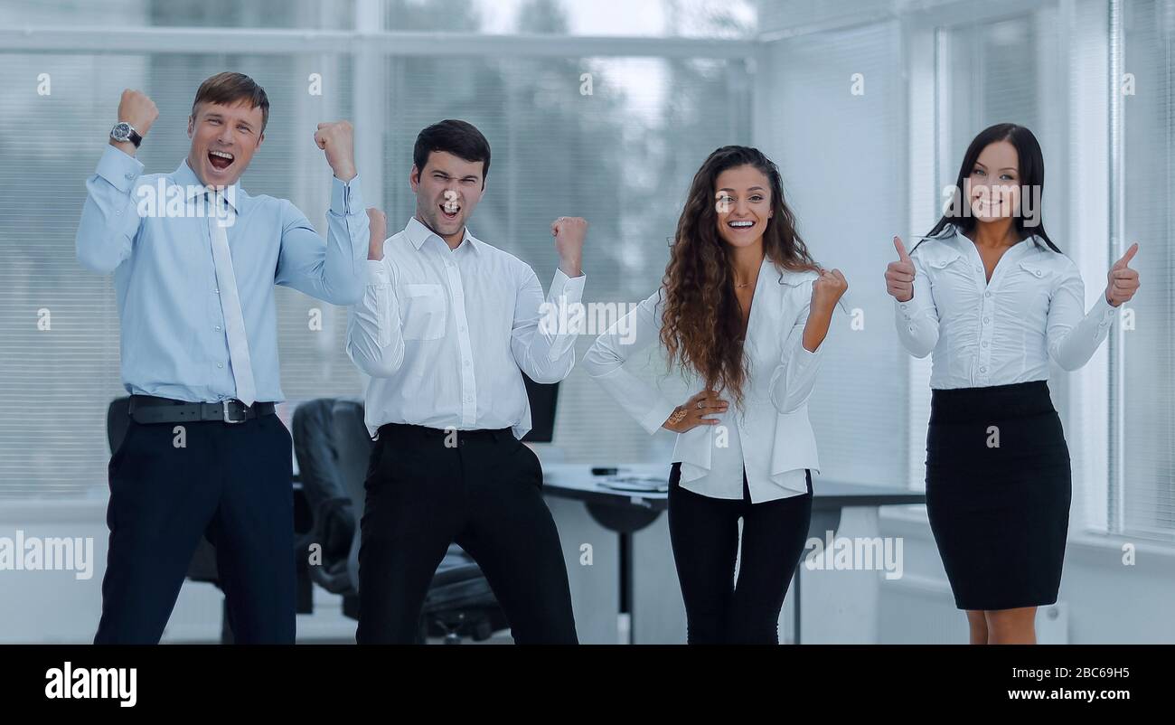 portrait of a triumphant business team Stock Photo - Alamy