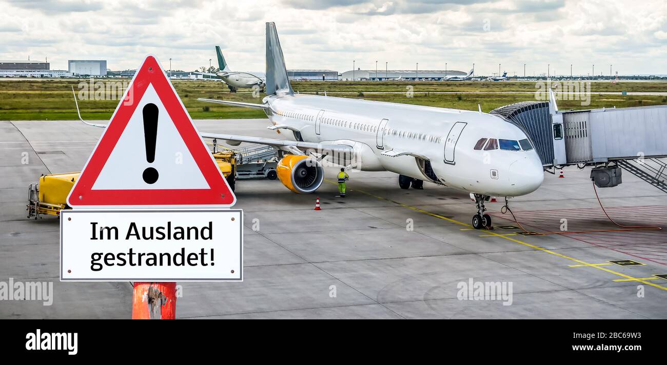 Warning sign stranded abroad in german Stock Photo