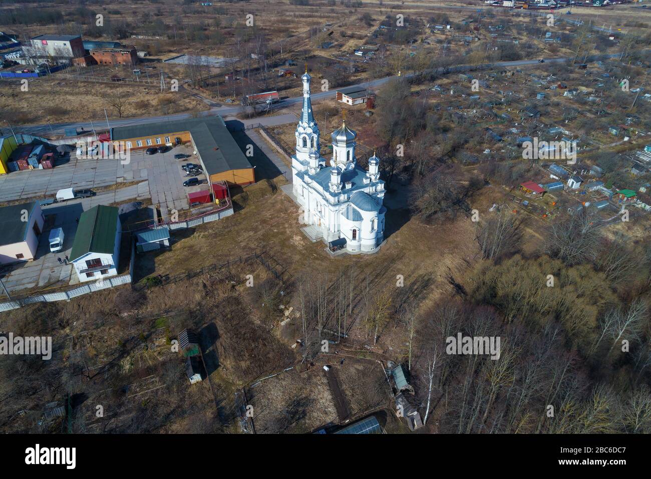 View of the Church of the Holy Martyr Tsaritsa Alexandra on a sunny March day (aerial photography). The village of Nizino. Leningrad region, Russia Stock Photo