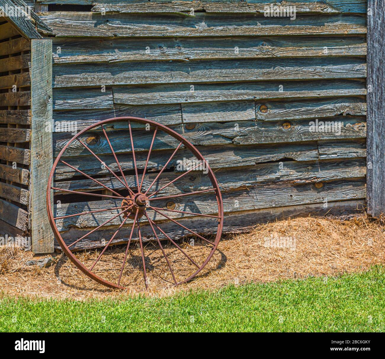 Rusty Wheel on Working Barn Stock Photo