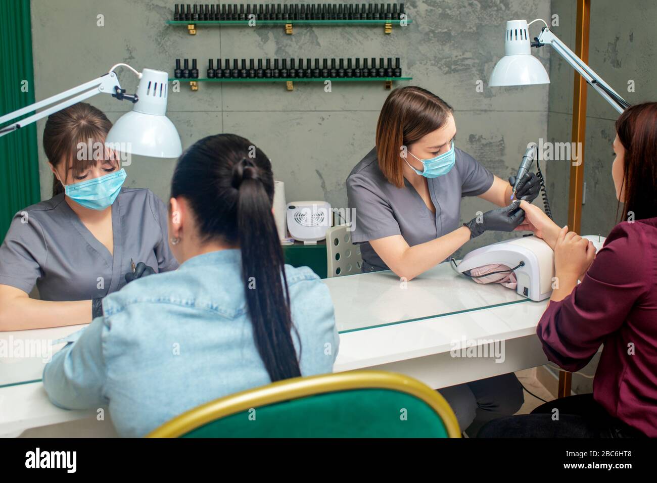 Women getting a manicure in beauty salon Stock Photo - Alamy