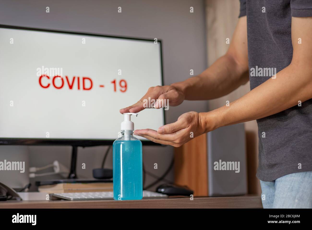 using hand sanitizer gel cleaning hands at home Stock Photo Alamy