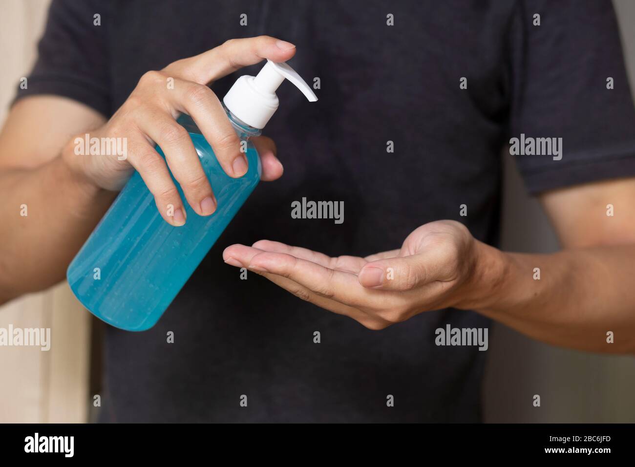 using hand sanitizer gel cleaning hands at home Stock Photo Alamy