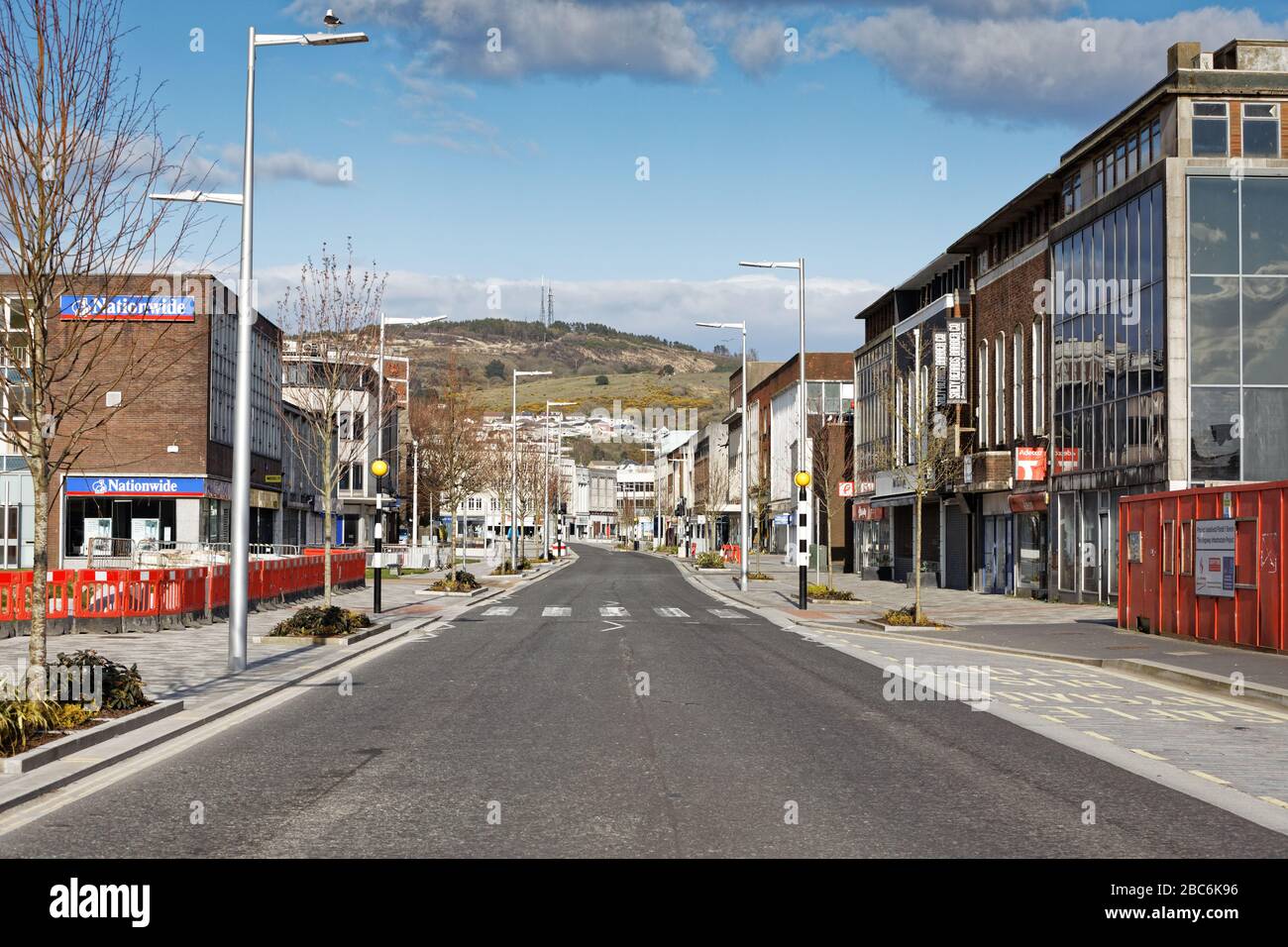 Pictured: The Kingsway, one of the busiest roads in the centre of town, is now deserted in Swansea, Wales, UK. Sunday 29 March 2020 Re: Desertion caus Stock Photo