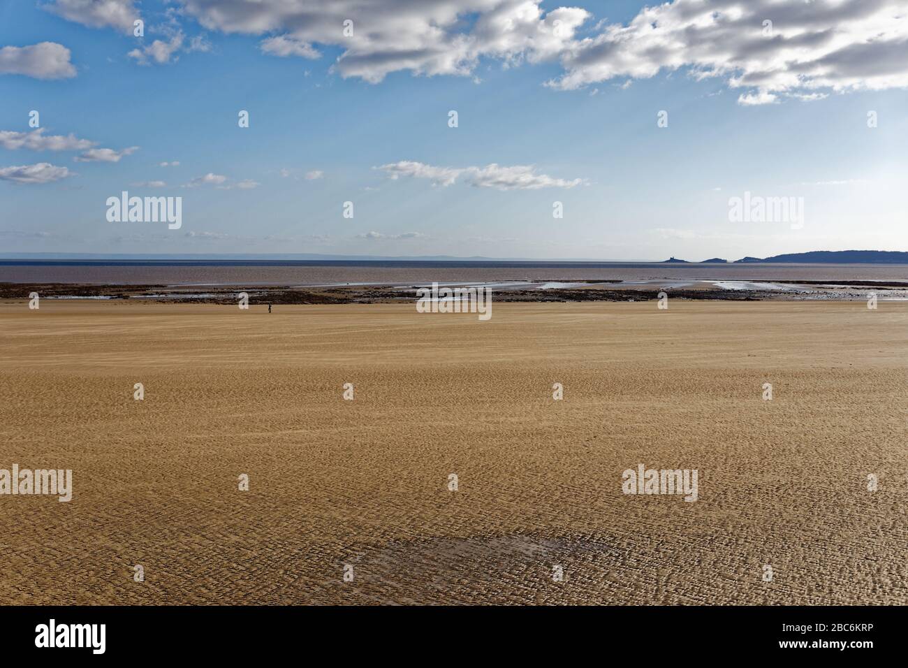 Pictured: The beach, which is usually busy with people on Sunday afternoon when it is sunny, is now deserted in Swansea, Wales, UK. Sunday 29 March 20 Stock Photo
