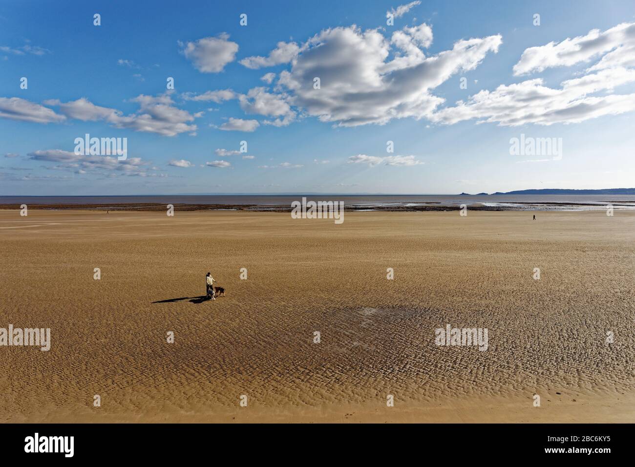 Pictured: The beach, which is usually busy with people on Sunday afternoon when it is sunny, is now deserted in Swansea, Wales, UK. Sunday 29 March 20 Stock Photo