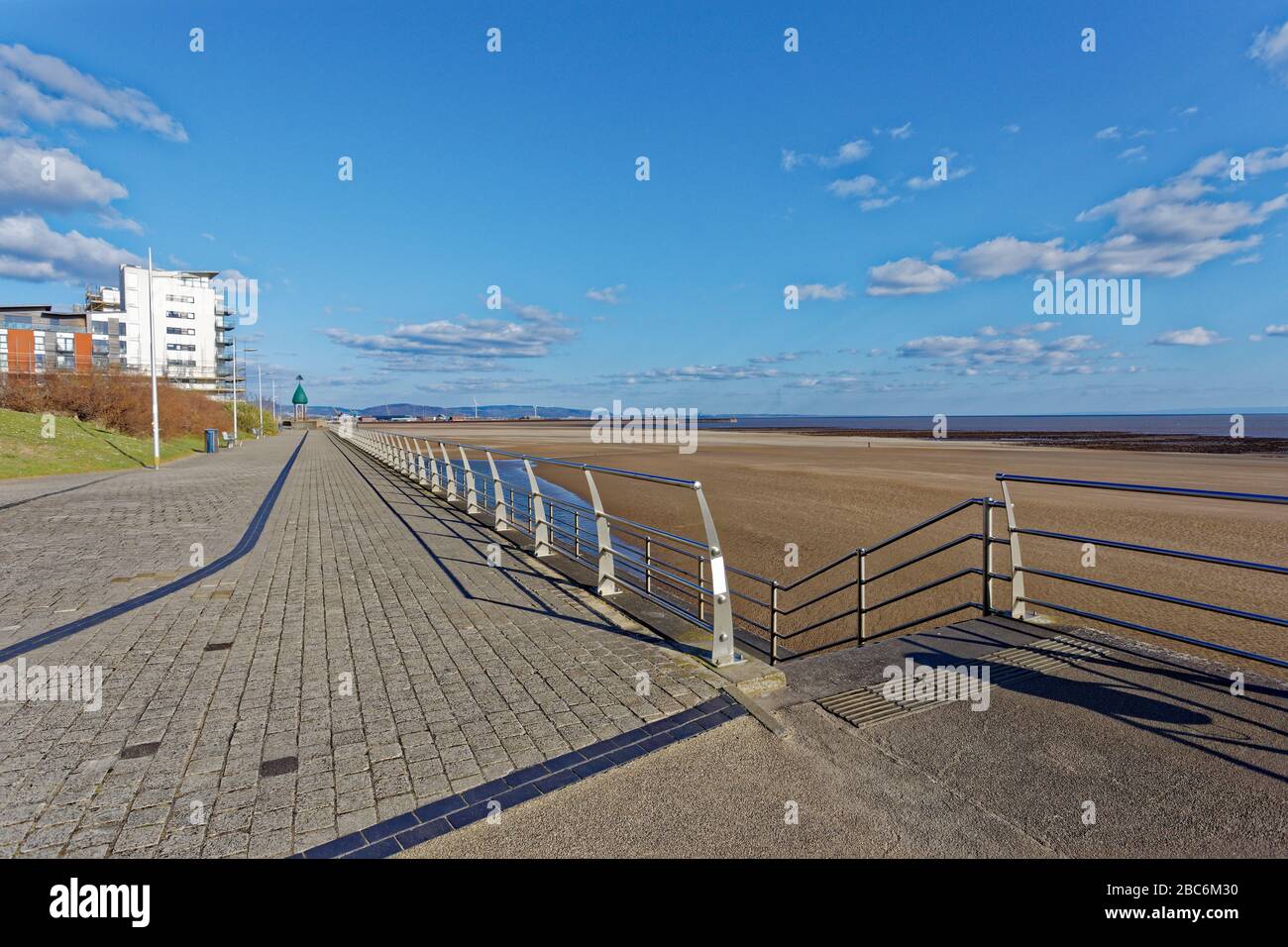 Pictured: The promenade, which is usually busy with people on Sunday afternoon when it is sunny, is now deserted in Swansea, Wales, UK. Sunday 29 Marc Stock Photo