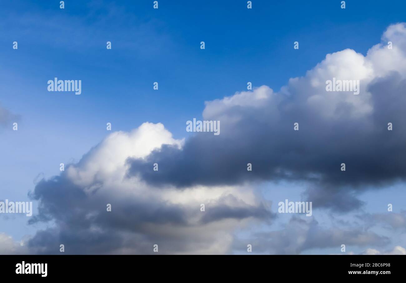 Beautiful white fluffy clouds in a blue sky on a sunny summer day Stock ...