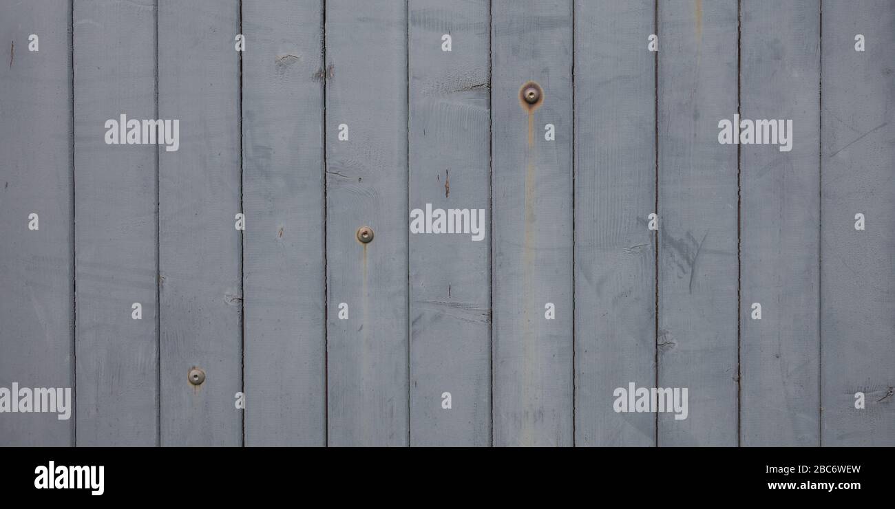 Weathered Wood Plank Barn Siding Background with Rusty Nailheads Stock