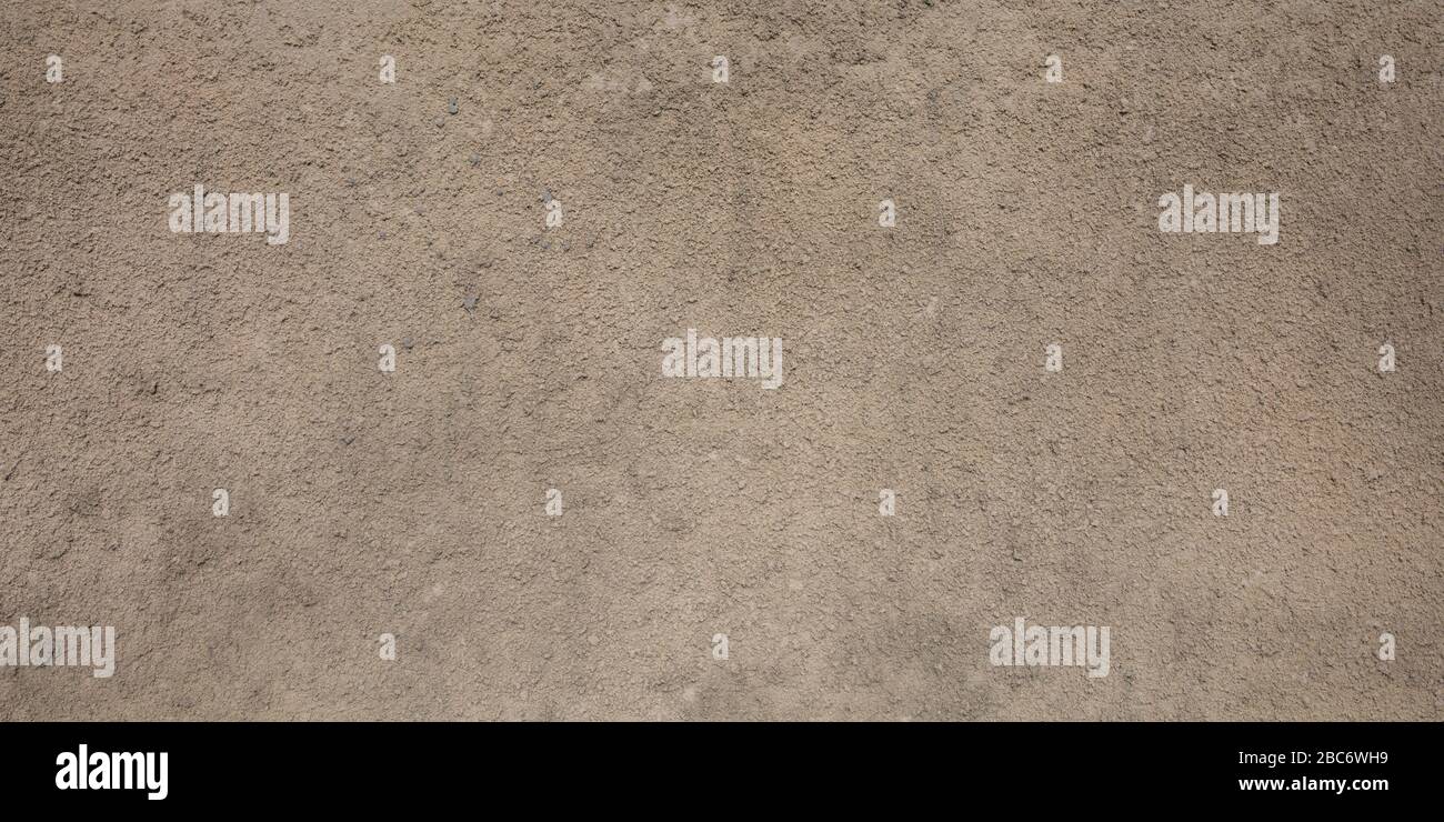 gray beige porous granular wall background texture with paint color