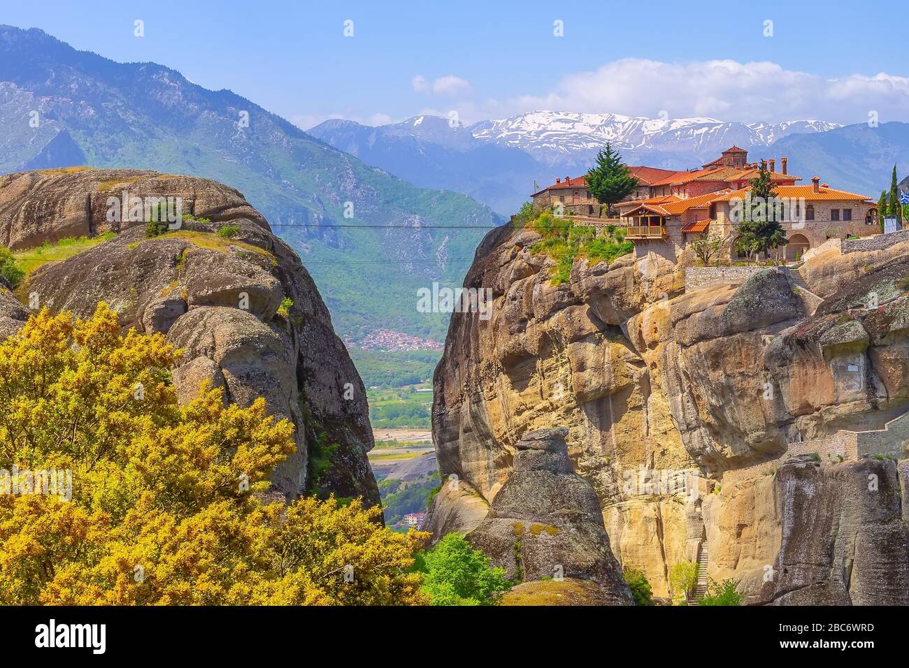 Meteora Greece Agios Stefanos St Stefan Monastery On Cliff Mountain Rock And Snow Peaks Stock Photo Alamy