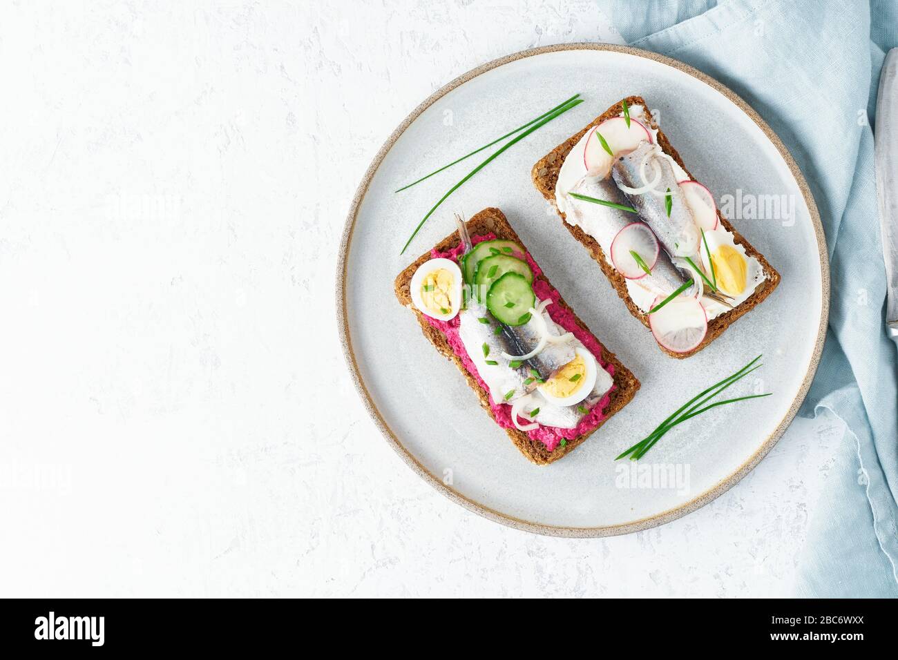 Savory fish smorrebrod, set of five traditional Danish sandwiches. Black rye bread Stock Photo