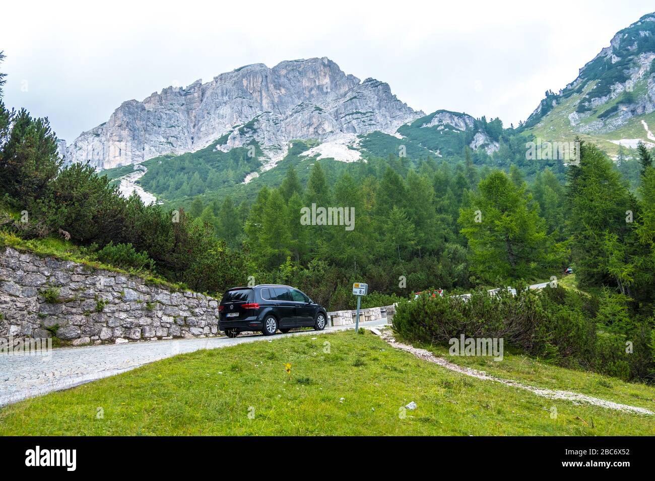 Triglav, Slovenia - August 11, 2019: Scenic view of alpine landscape and car on mountain road in Triglav national park. Julian alps, Triglav, Slovenia Stock Photo