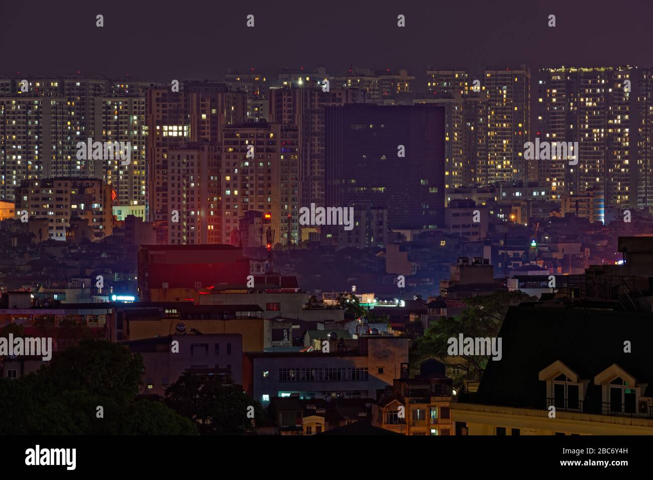 Night city scene of apartment buildings in Bach Dang district of Hanoi in Vietnam Stock Photo