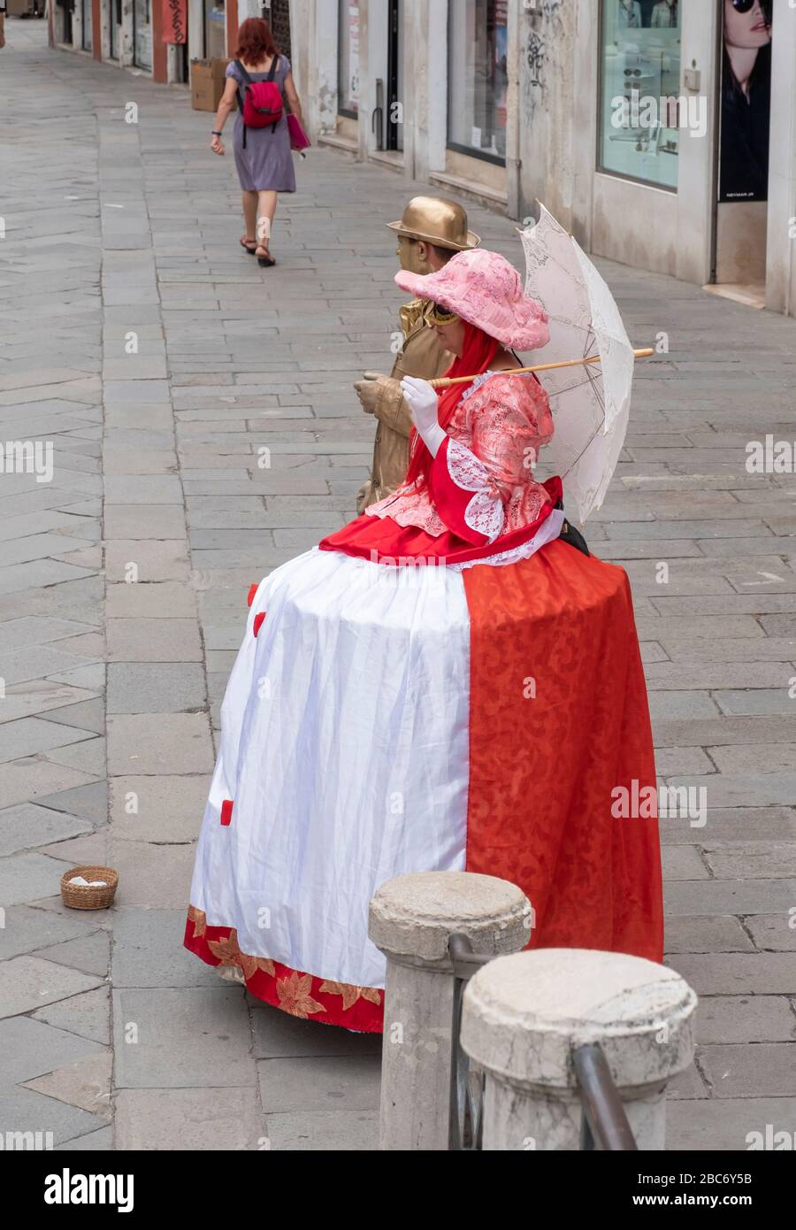 Venice, Italy June 30, 2017 two people in woman red clothes
