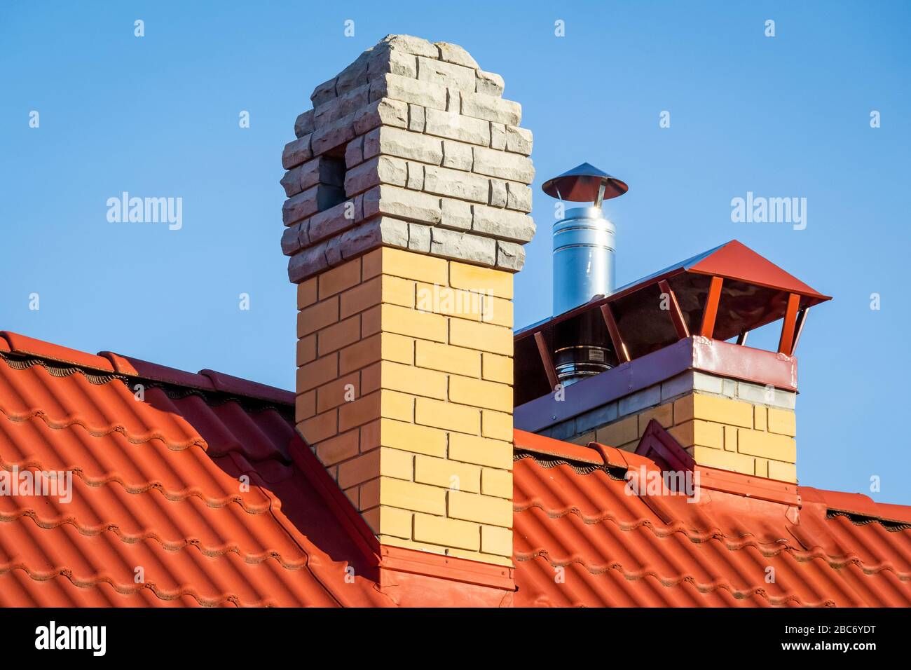 Brick pipe on the roof of a private house Stock Photo Alamy