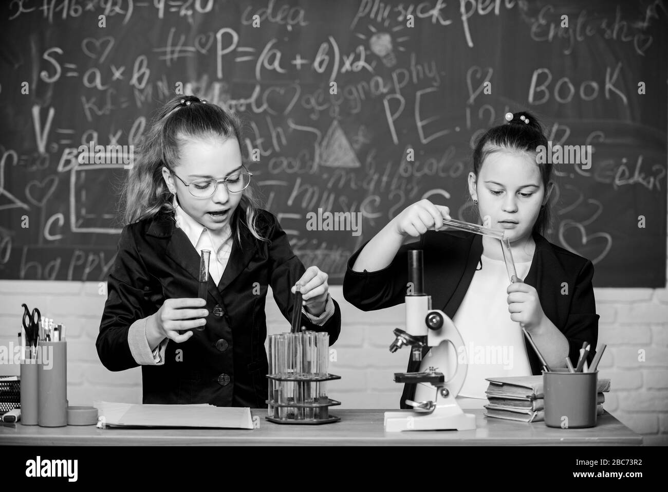 For a better tomorrow. Little girls genius in school lab. Science lab. science experiments in