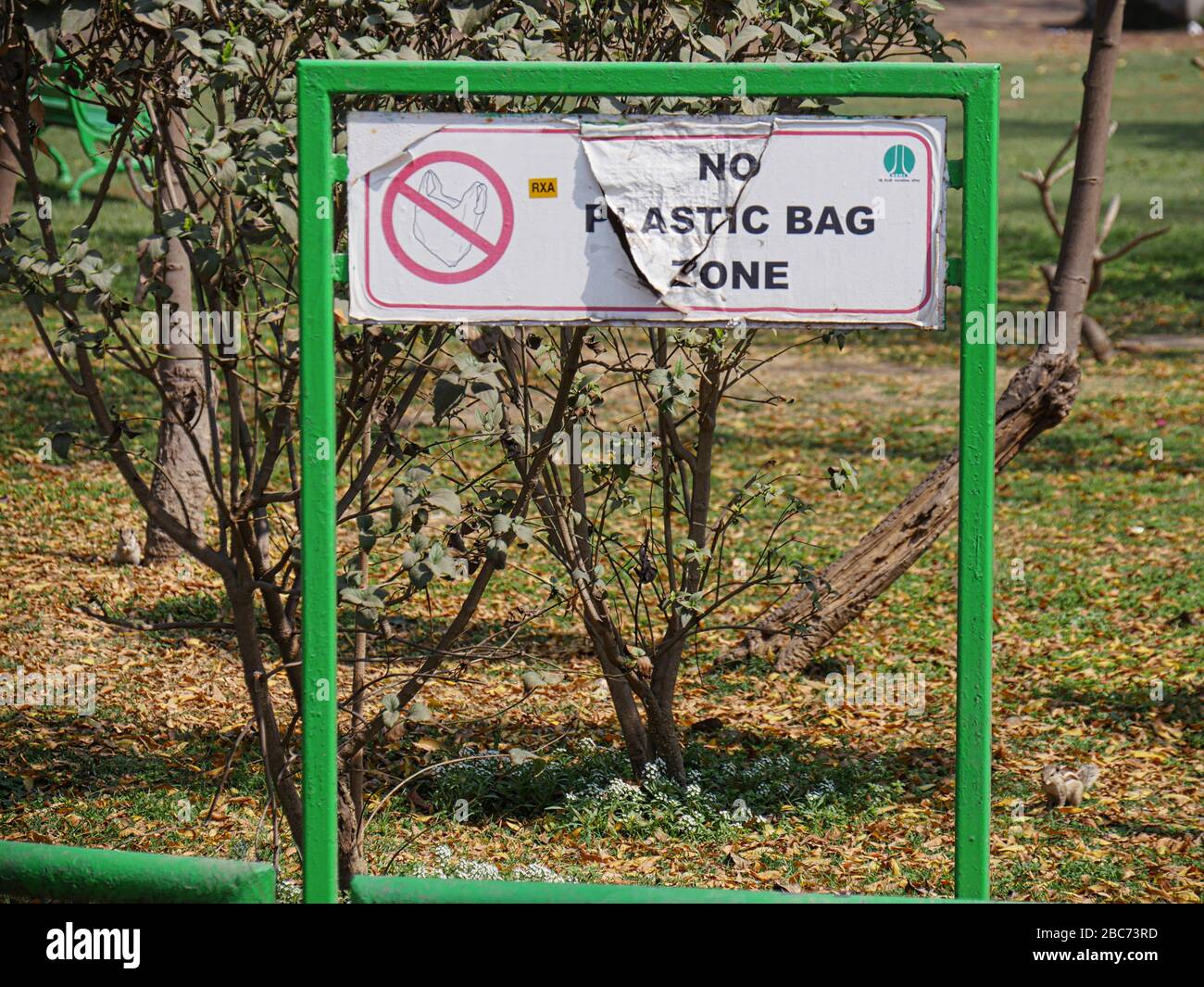 New Delhi, India- March 2018: Torn sign at the Lodi Gardens for No Plastic Bag Zone, New Delhi. Stock Photo