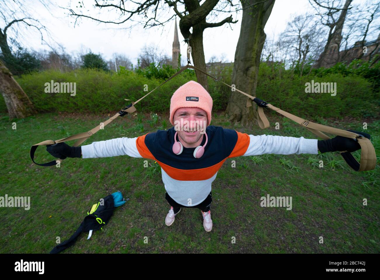 Glasgow, Scotland, UK. 3 April, 2020. Images from the southside of Glasgow at the end of the second week of Coronavirus lockdown. Pictured, Hamish Orr a resident of Govanhill works out in Queens Park.   Iain Masterton/Alamy Live News Stock Photo