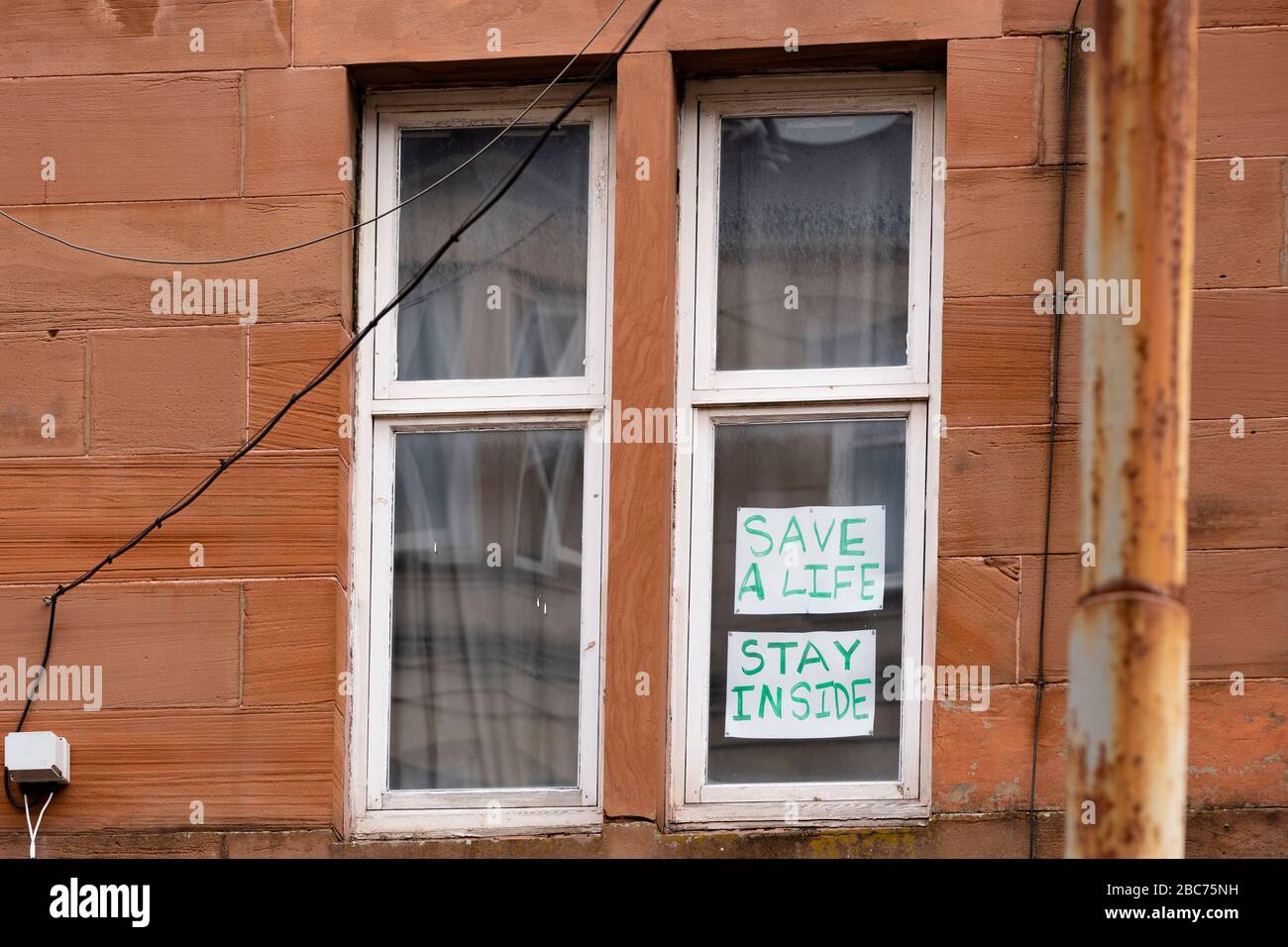 Glasgow, Scotland, UK. 3 April, 2020. Images from the southside of Glasgow at the end of the second week of Coronavirus lockdown. Pictured; hand drawn rainbows and messages in windows of flats in Govanhill and Shawlands. Iain Masterton/Alamy Live News Stock Photo
