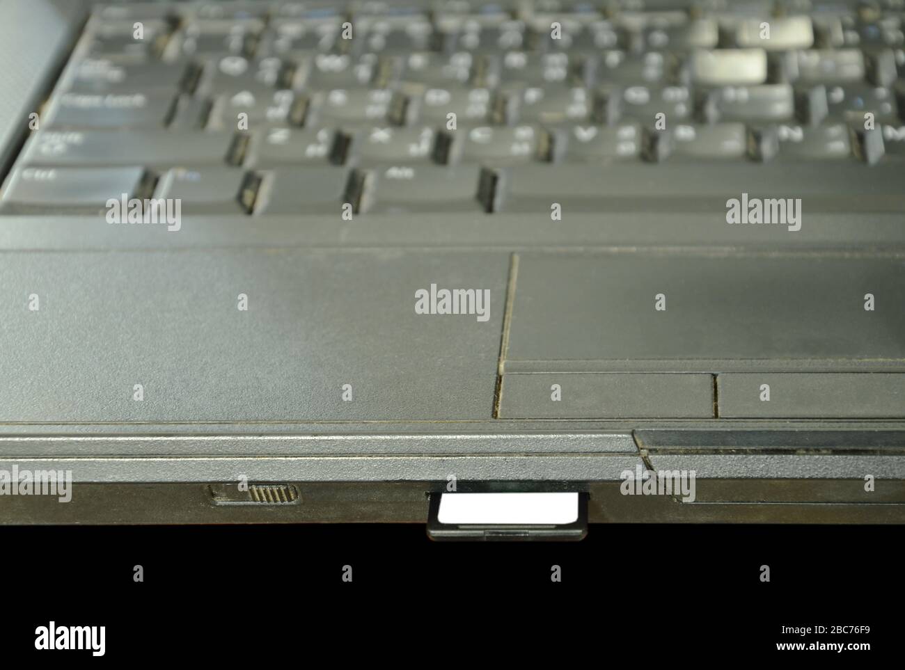 SD card put in computer notebook multimedia reader Stock Photo Alamy